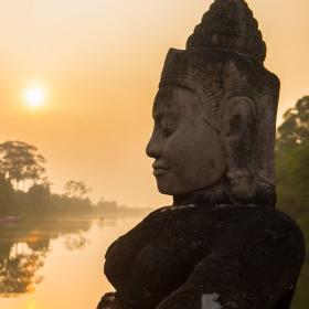 Buddha is shown over a body of water in Angkor Wat, where Projects Abroad volunteers visit and educate themselves on Khmer history.